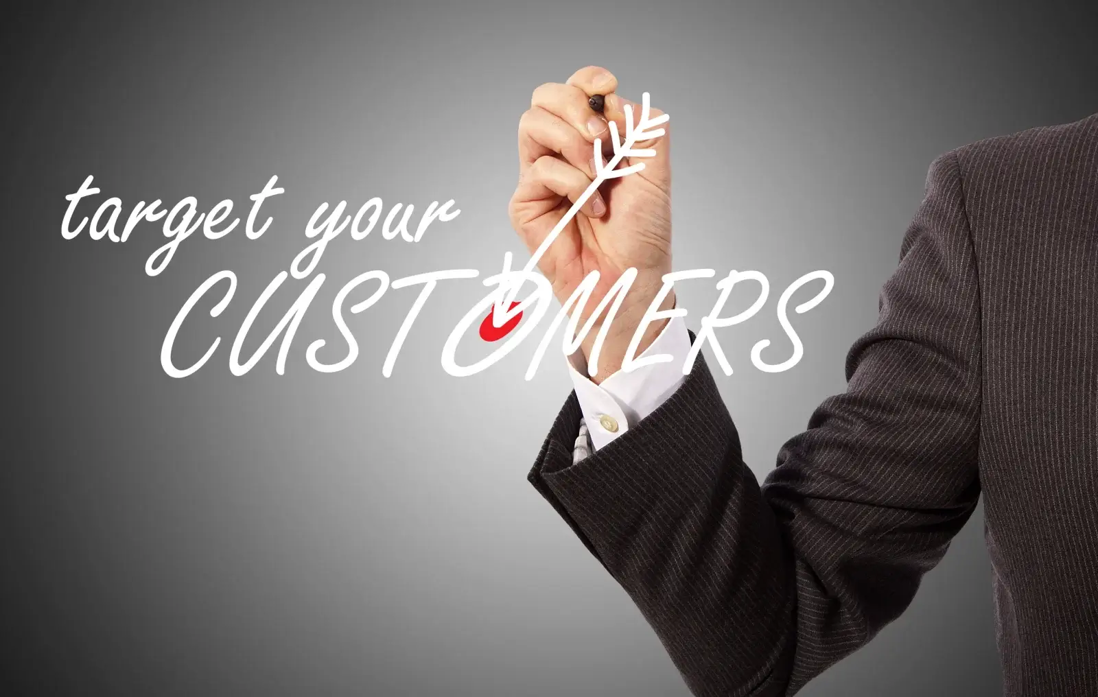 A person in a suit writes "target your CUSTOMERS" on glass with a drawn arrow pointing to the word "CUSTOMERS" against a gradient gray background.